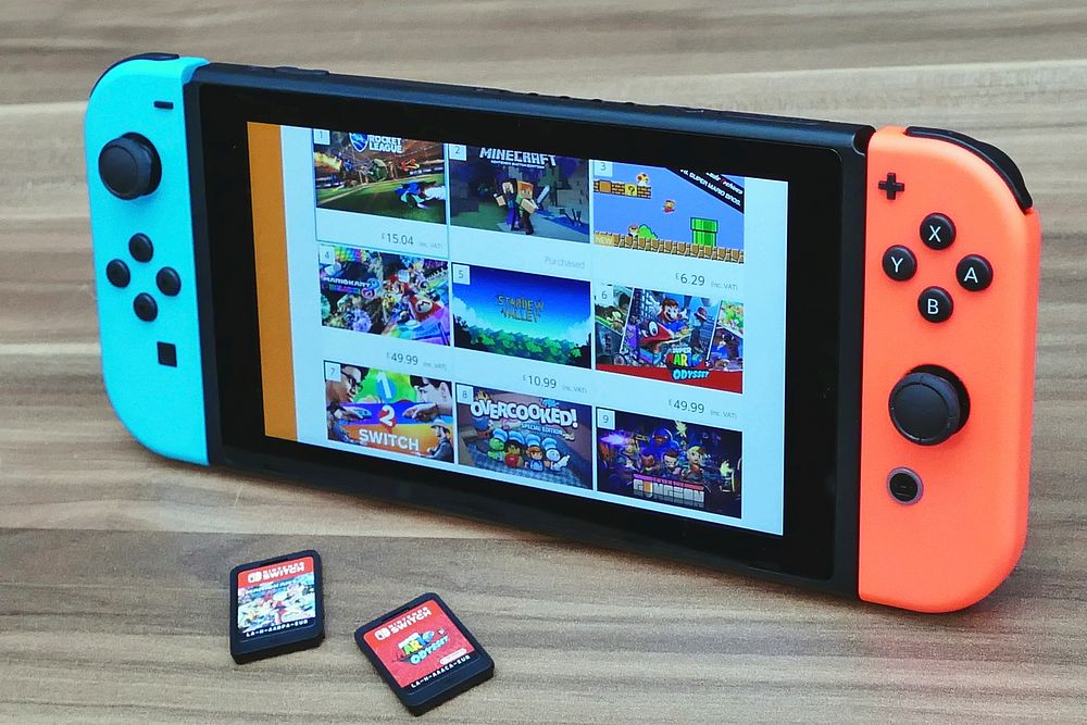 Nintendo Switch console displaying popular titles of the best Nintendo Switch games (game Nintendo Switch terbaik).
